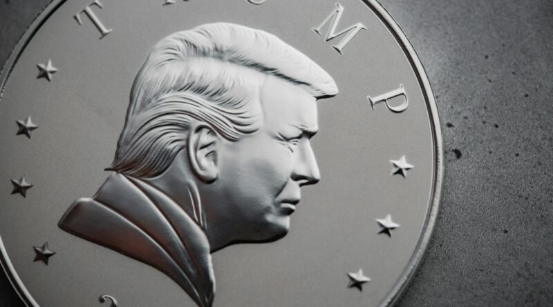 a close up of a silver coin with a picture of president donald