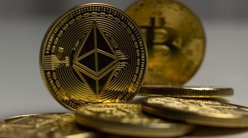 a pile of gold bitcoins sitting on top of a table