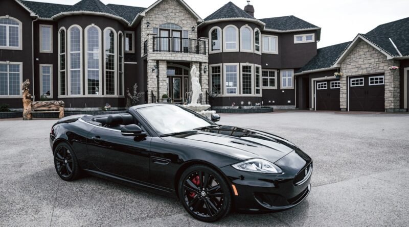 black convertible coupe parked near house